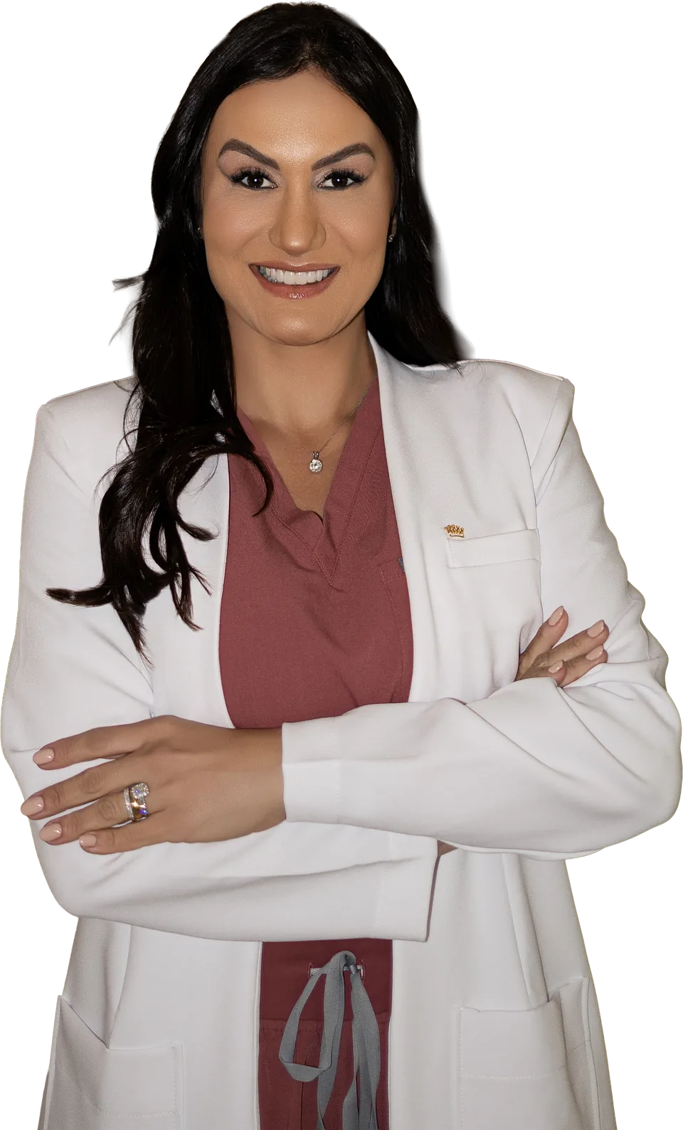 Bianca Lemos in a white coat, arms crossed, smiling